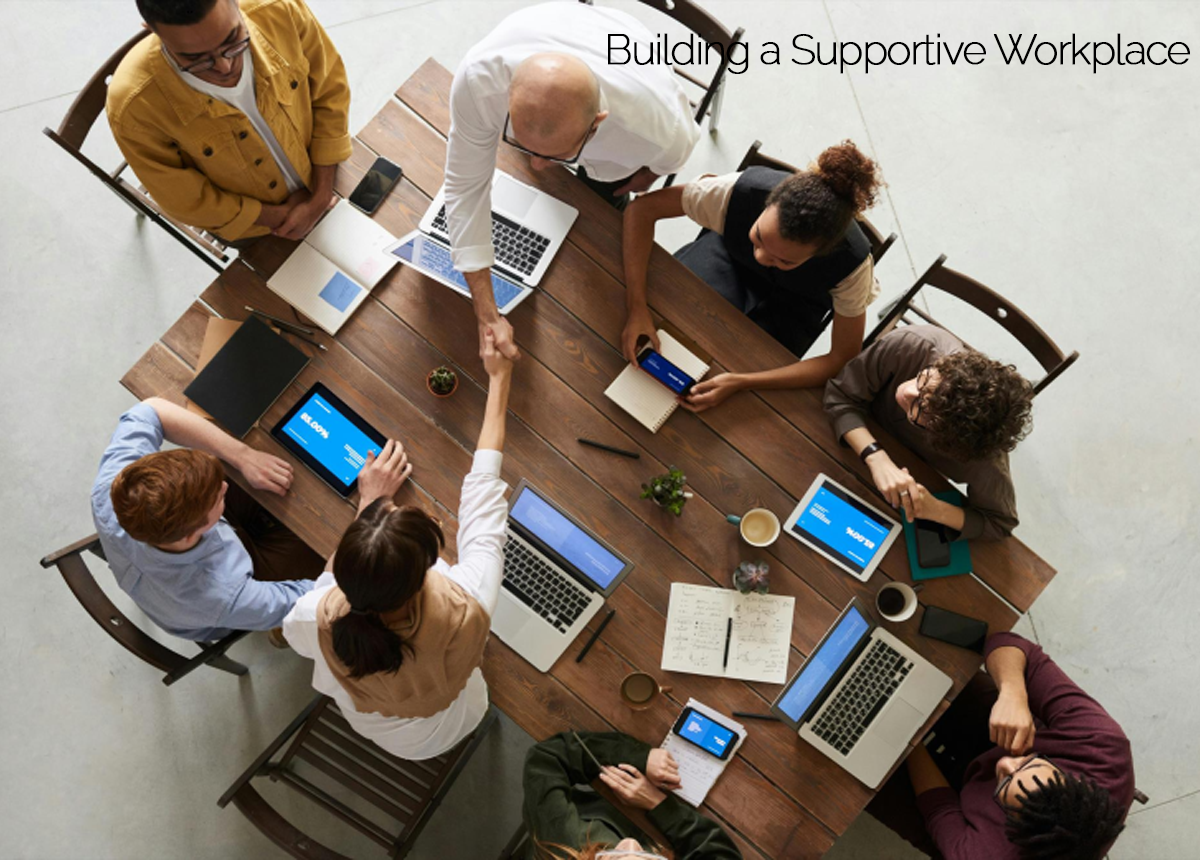 Group of team coworkers around a table.